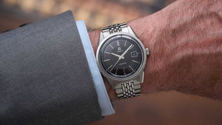 Tissot Visodate Review: New 2026 Tissot Visodate black dial on wrist beads of rice bracelet