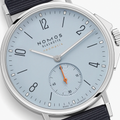 Close-up of Ahoi Neomatik Sky dial in light blue with bold numerals small seconds subdial and orange hand