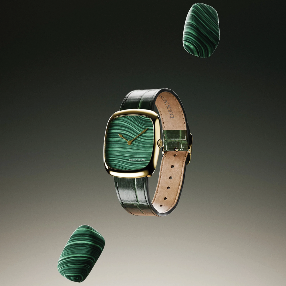 Floating view of a gold case watch with green malachite dial on a green leather strap