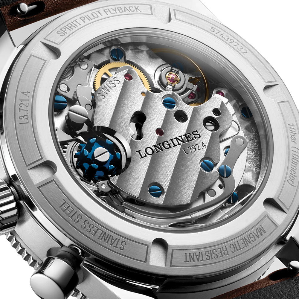 Close-up of the Longines Spirit Pilot Flyback movement visible through a sapphire case back with blue screws
