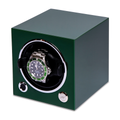 Green single watch winder with a round display opening and a metal bracelet watch inside