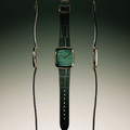 Natural malachite dial watch in a gold square case with green leather strap