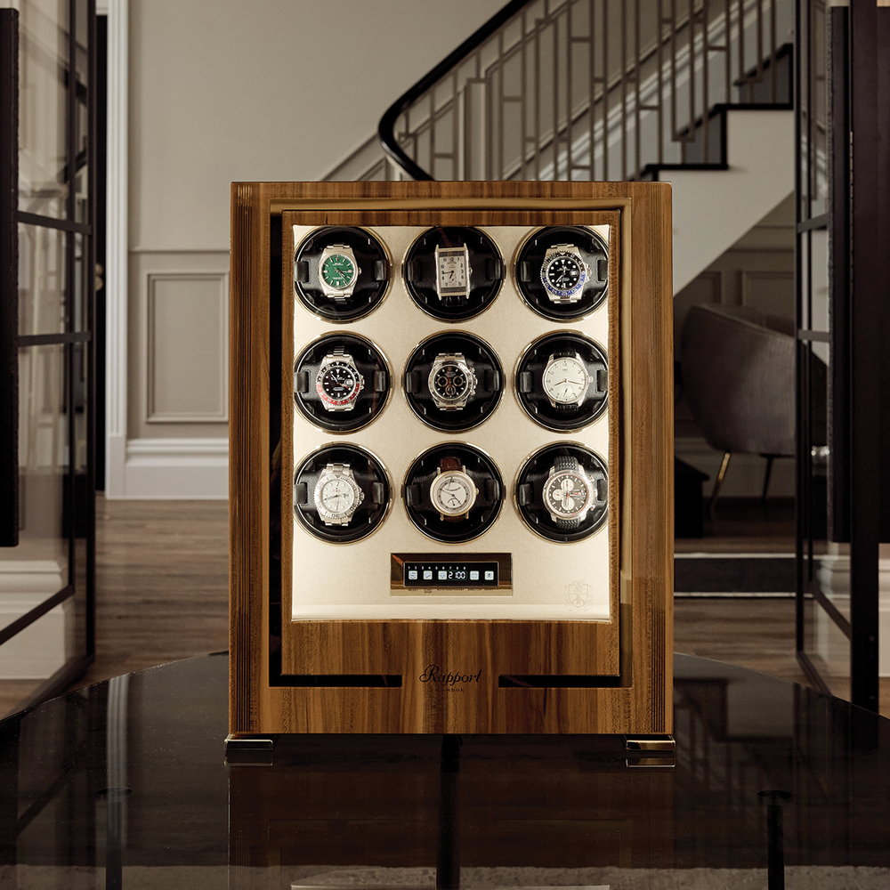 Brown Parmaount Nine watch winder displayed in an elegant room with watches
