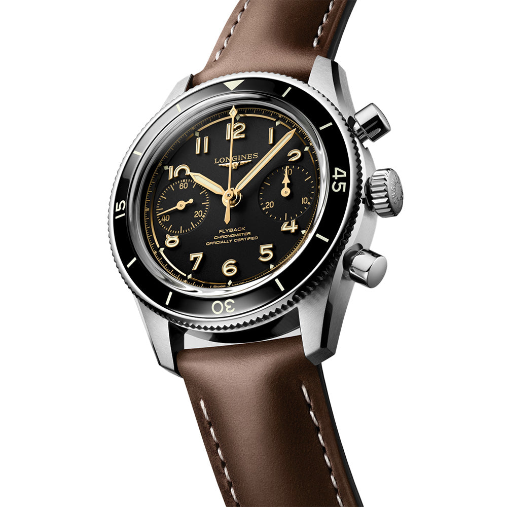 Longines Spirit Pilot Flyback watch with black dial gold numerals and brown leather strap.