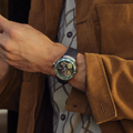 Wrist view of Accutron ElectroStatic DNA 45mm grey on rubber strap worn by a man