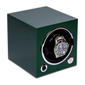 Green single watch winder box with a stainless steel watch mounted in the circular holder