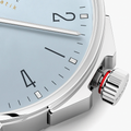 Close up of Ahoi Neomatik Sky blue dial with slim silver hands and black index markers