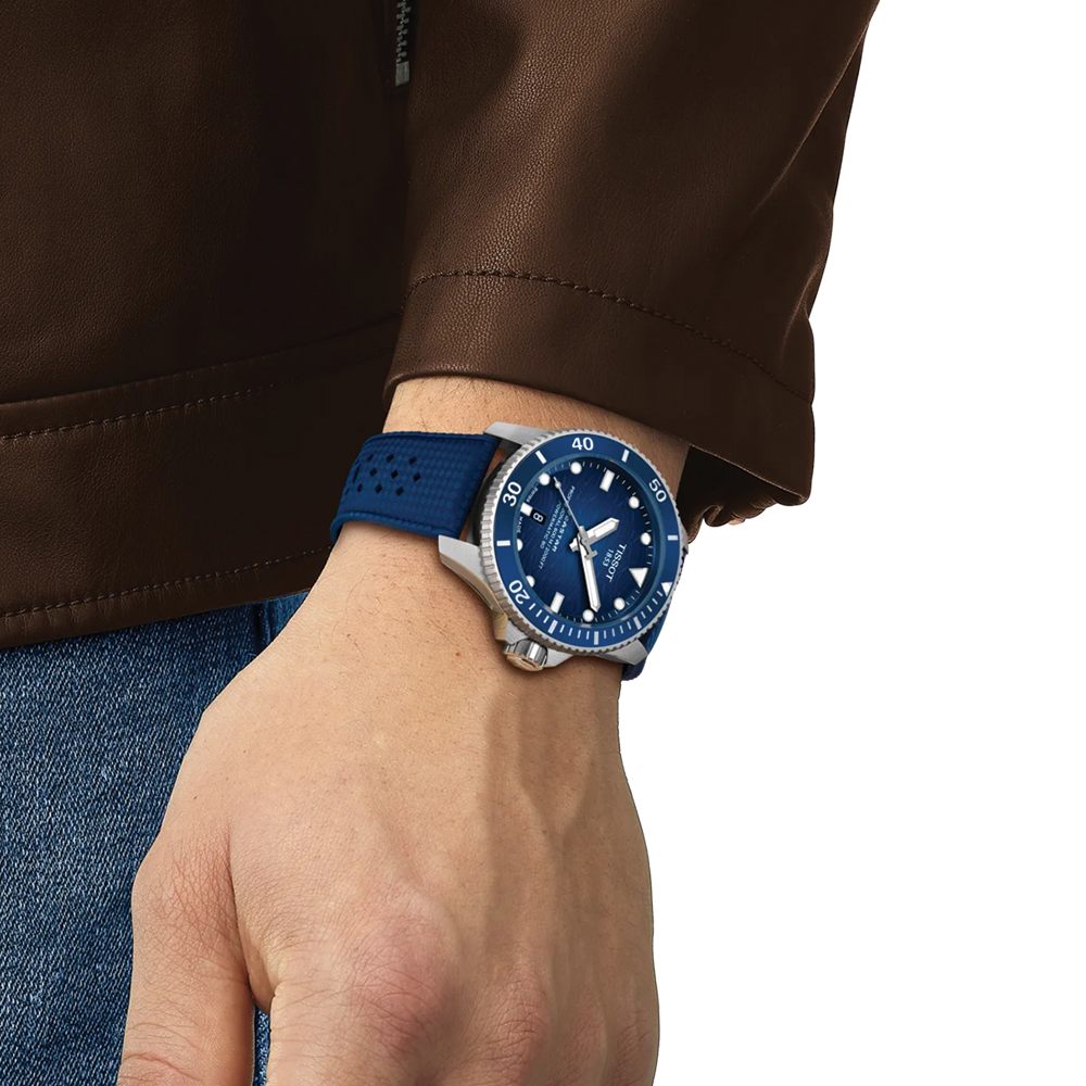 Wrist shot of the blue Seastar 2000 professional on blue rubber strap.