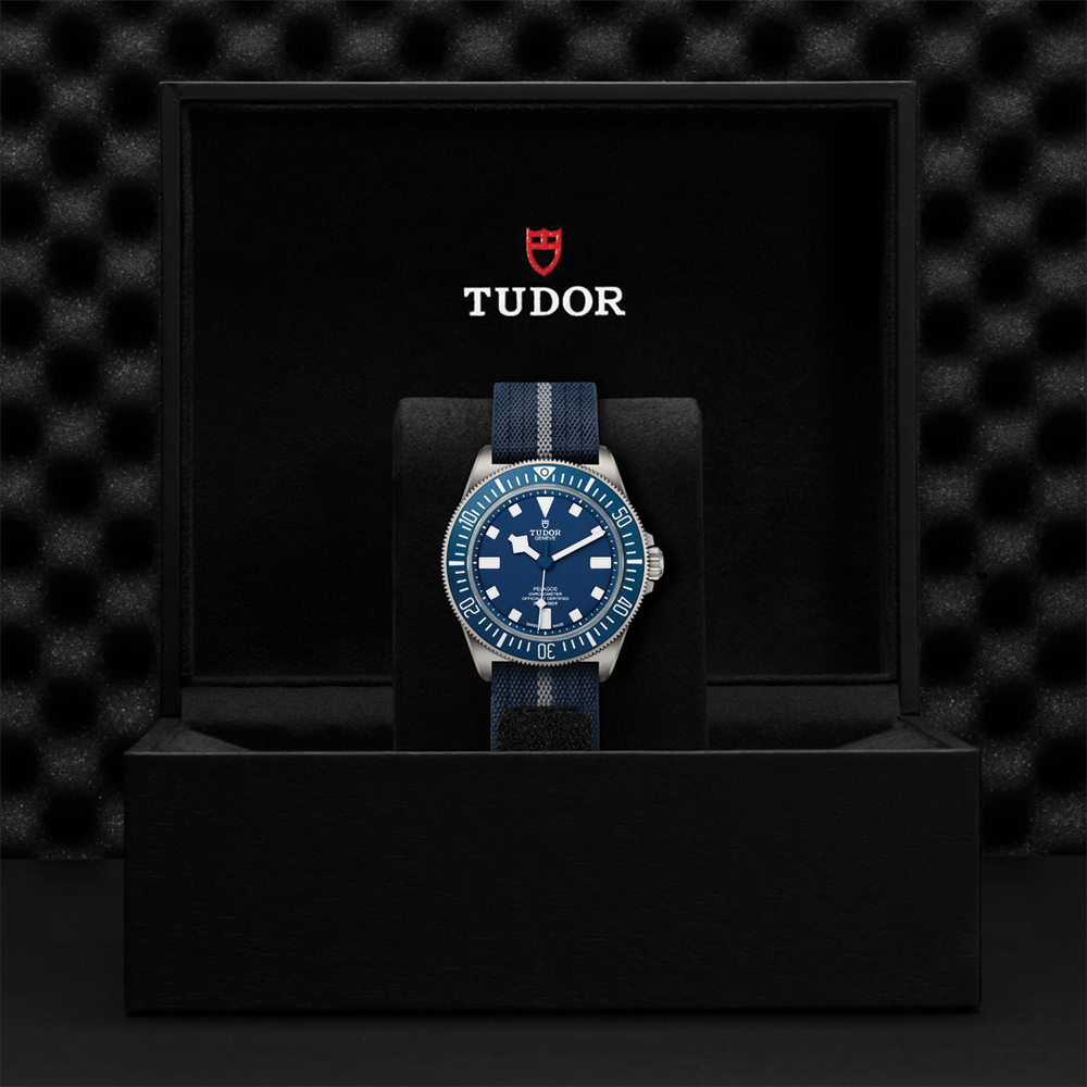 Pelagos FXD Titanium 42mm blue dial watch on blue fabric strap in a Tudor presentation box with an extra rubber strap