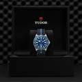 Pelagos FXD Titanium 42mm blue dial watch on blue fabric strap in a Tudor presentation box with an extra rubber strap