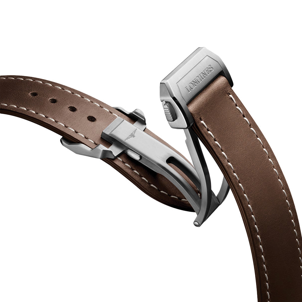 Brown leather strap with a silver folding clasp engraved Longines