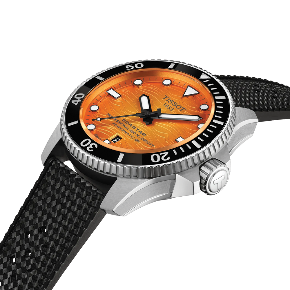 Close up of Tissot Seastar 2000 diver watch with orange dial, black bezel and silver case on a black rubber strap