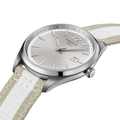 Tissot PR 100 quartz watch with textured silver dial and beige white striped fabric strap