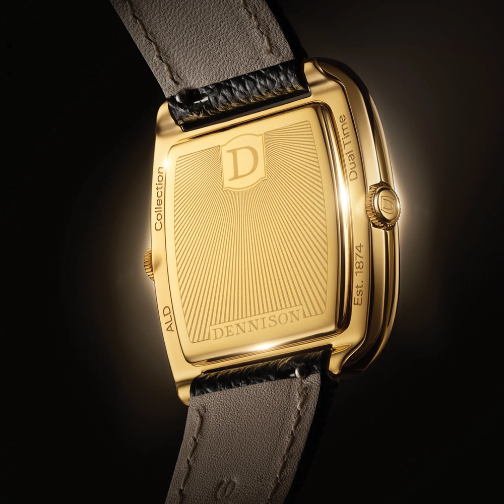 Gold Dennison watch back with sunburst engraving and D logo, Dual Time inscription, beige leather strap