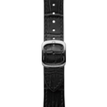 Close up of the black leather watch strap with a brushed metal buckle engraved Dennison