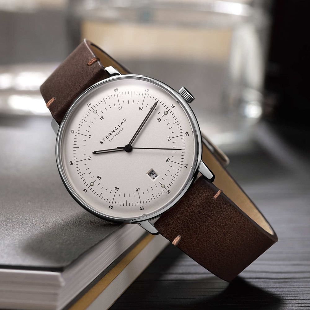 Sternglas Hamburg Quartz 42mm watch with white dial on a brown leather strap shown in a close-up