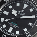 Close up of Tudor Pelagos dial with bold white hour markers and date window at 3 o'clock