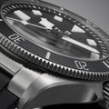 Close up of Pelagos watch bezel and dial showing bold markers and prominent hands