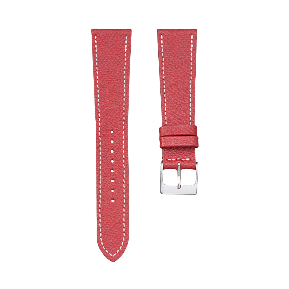 Two red textured calf leather watch strap pieces, one long pierced strap and one with a silver buckle.