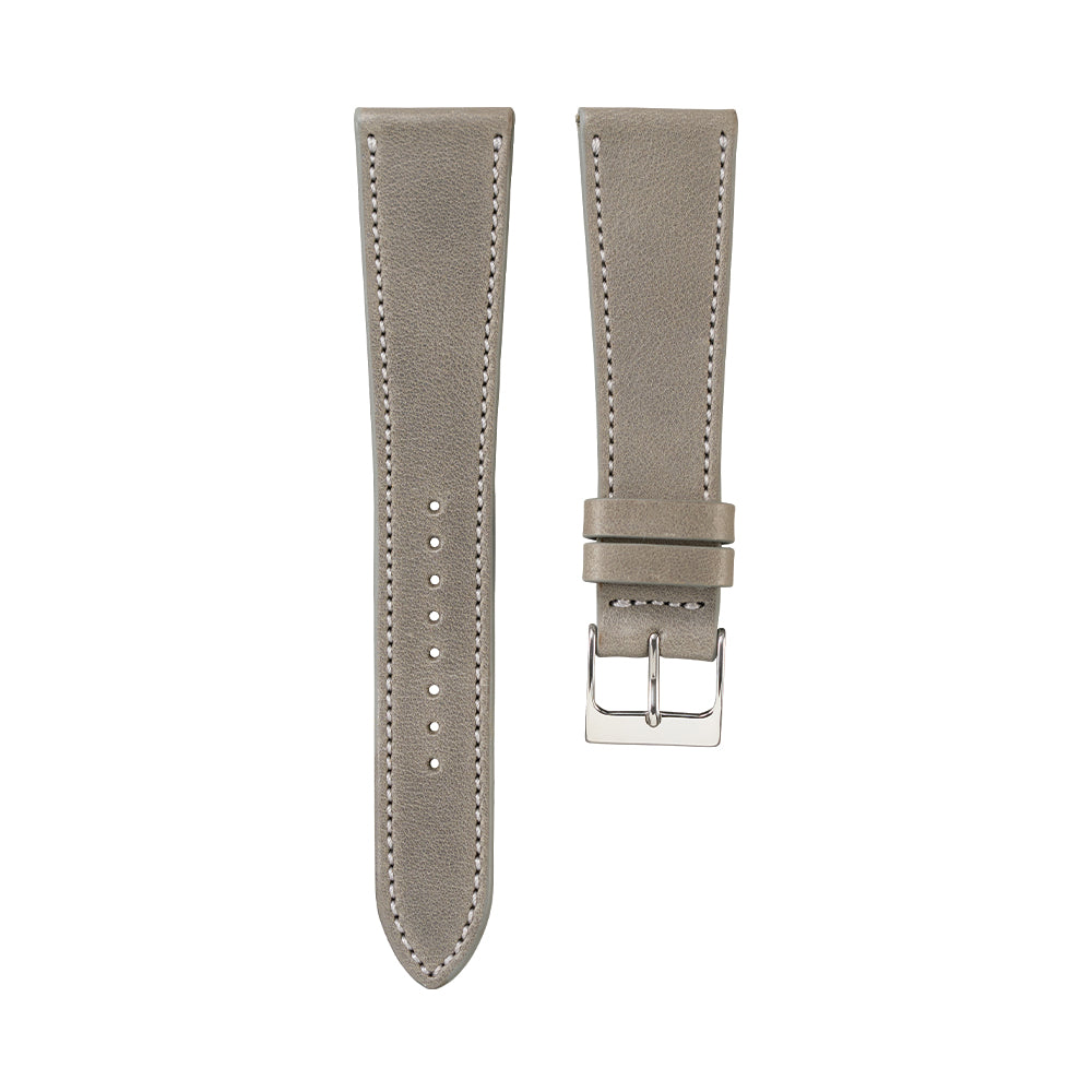 Grey French calfskin watch strap shown in two pieces with white stitching and a silver buckle
