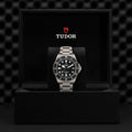 Tudor Pelagos dive watch in a black presentation box with stainless steel bracelet